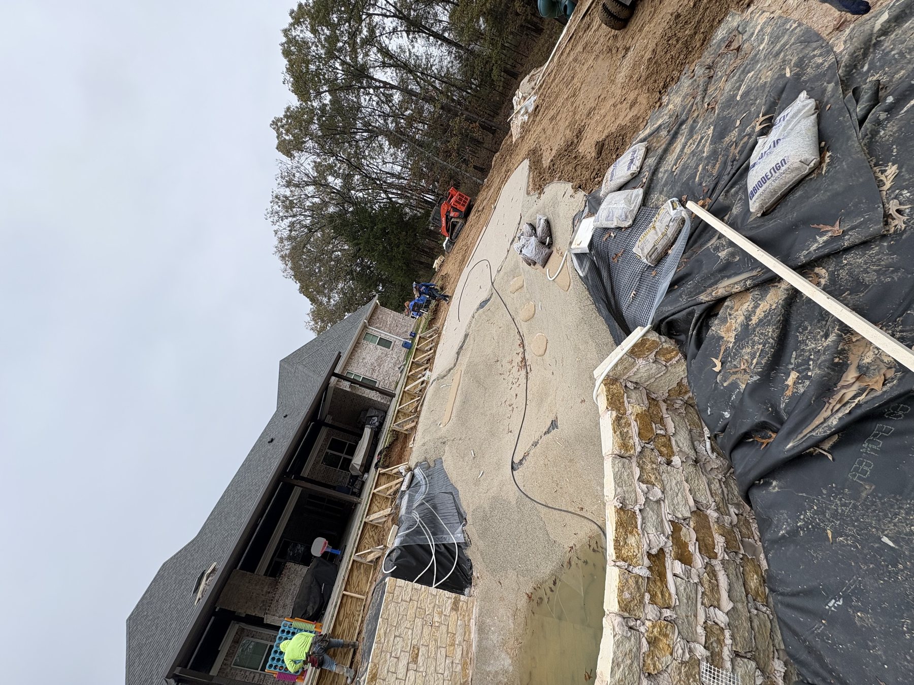 Backyard before its transformation — lagoon pool under construction