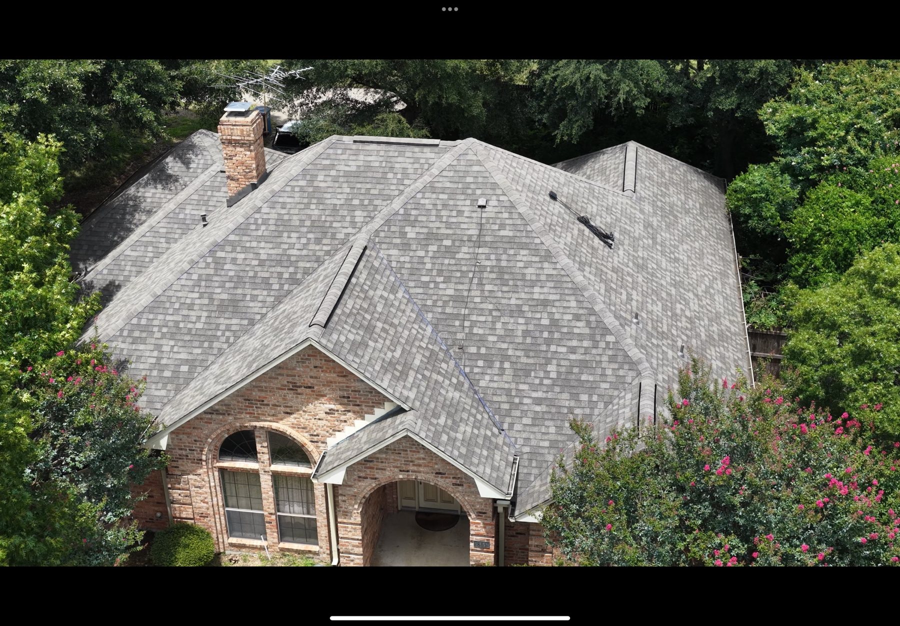 Completed architectural shingle roof replacement on a North Texas home