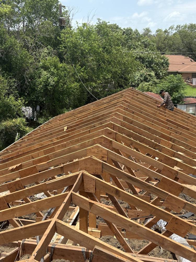 Roof framed down to the trusses before new decking goes on